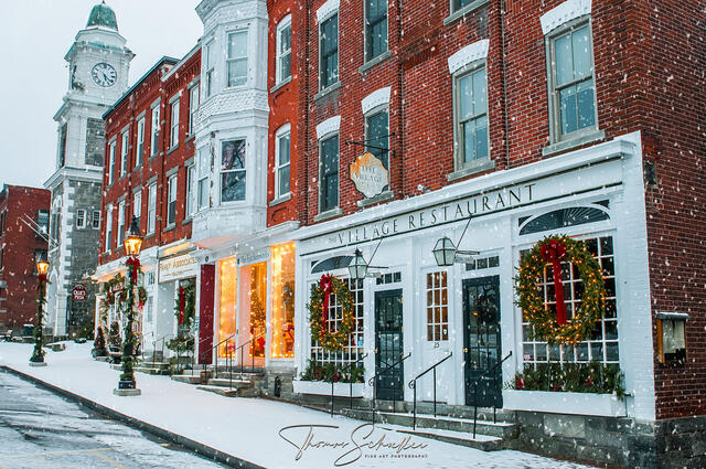 Heartwarming winter scene depicts the quaint village of Litchfield and the seasonal decorations along Main St & the Green on a snowy Christmas Morning