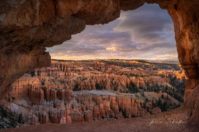 Stunning view through a natural arch overlooking the Bryce Canyon amphitheater at sunset | Limited Edition Utah National Park fine art photography prints 