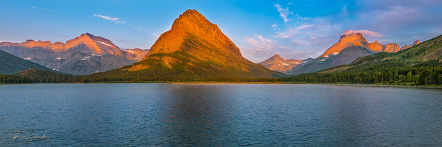 Breathtaking sunrise featuring the awe-inspiring Mt Grinnell as it towers over Swiftcurrent Lake in Glacier National Park | Limited Edition Fine Art prints   