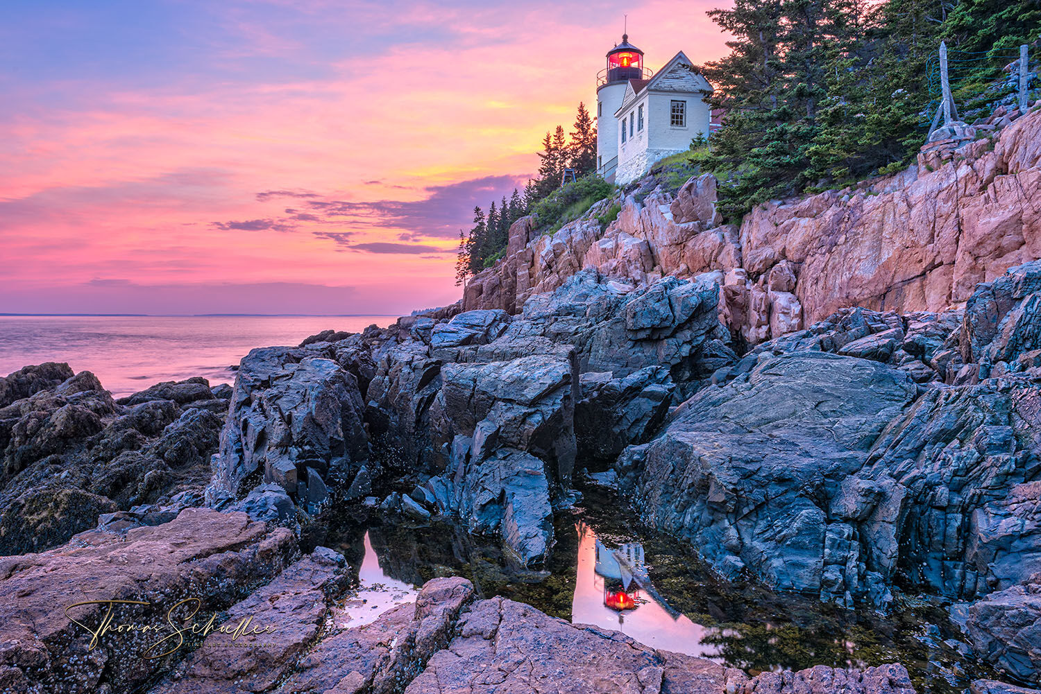 The Bass Head Lighthouse overlooking Maine's Bass Harbor during a fiery red sunset | Nautical Seascape Fine Art Prints for sale