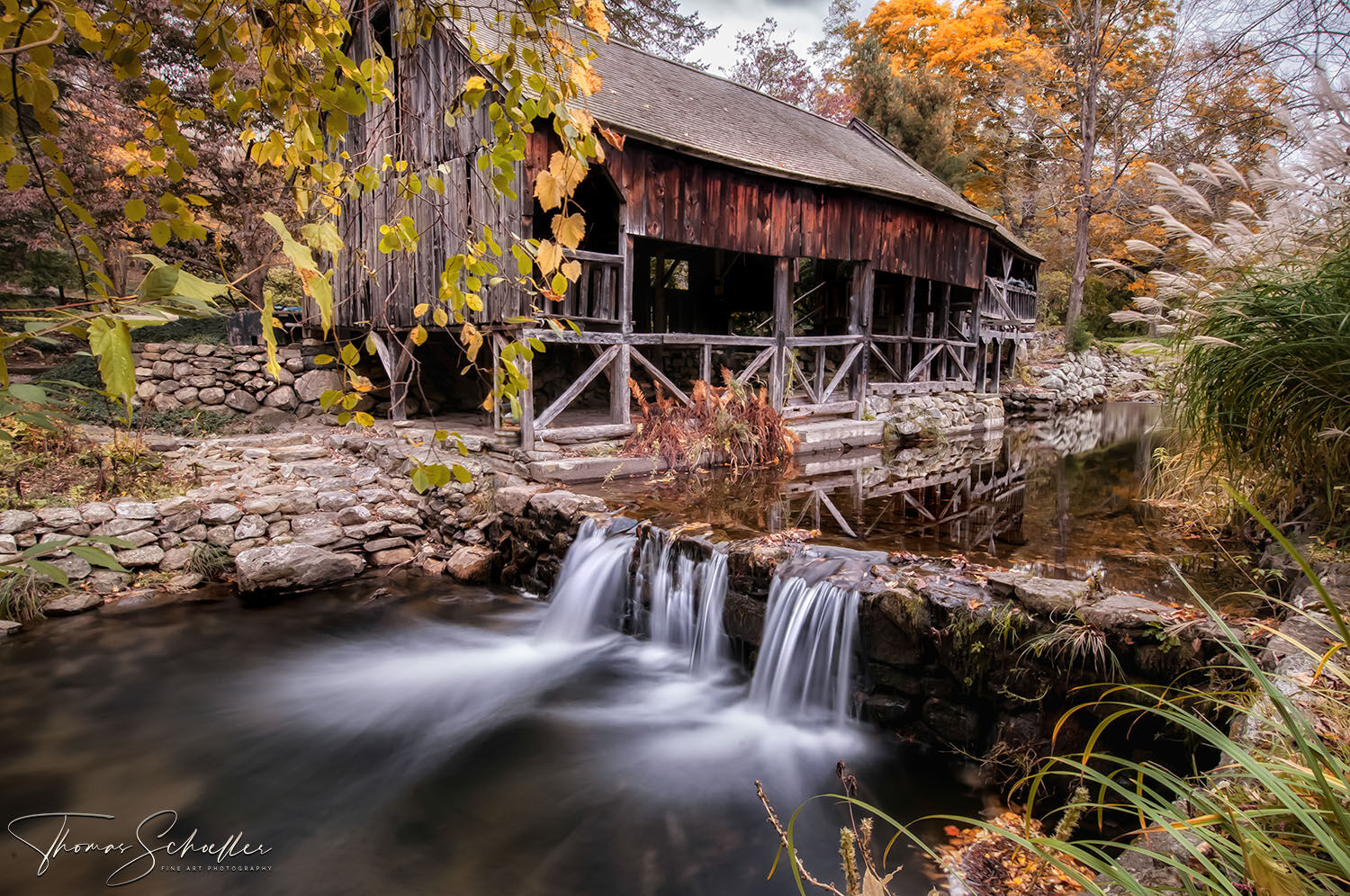 Historic pre-revolutionary New England stamping Mill reaps with rustic charm along a babbling brook and falls in Connecticut's Litchfield Hills | Buy Prints