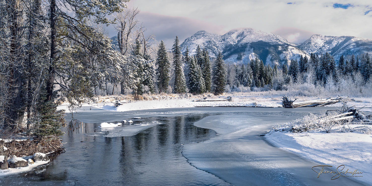 Gorgeous western Montana winter landscape | The beautiful Swan River flows south between the snow-covered Mission and Swan Mountain ranges  